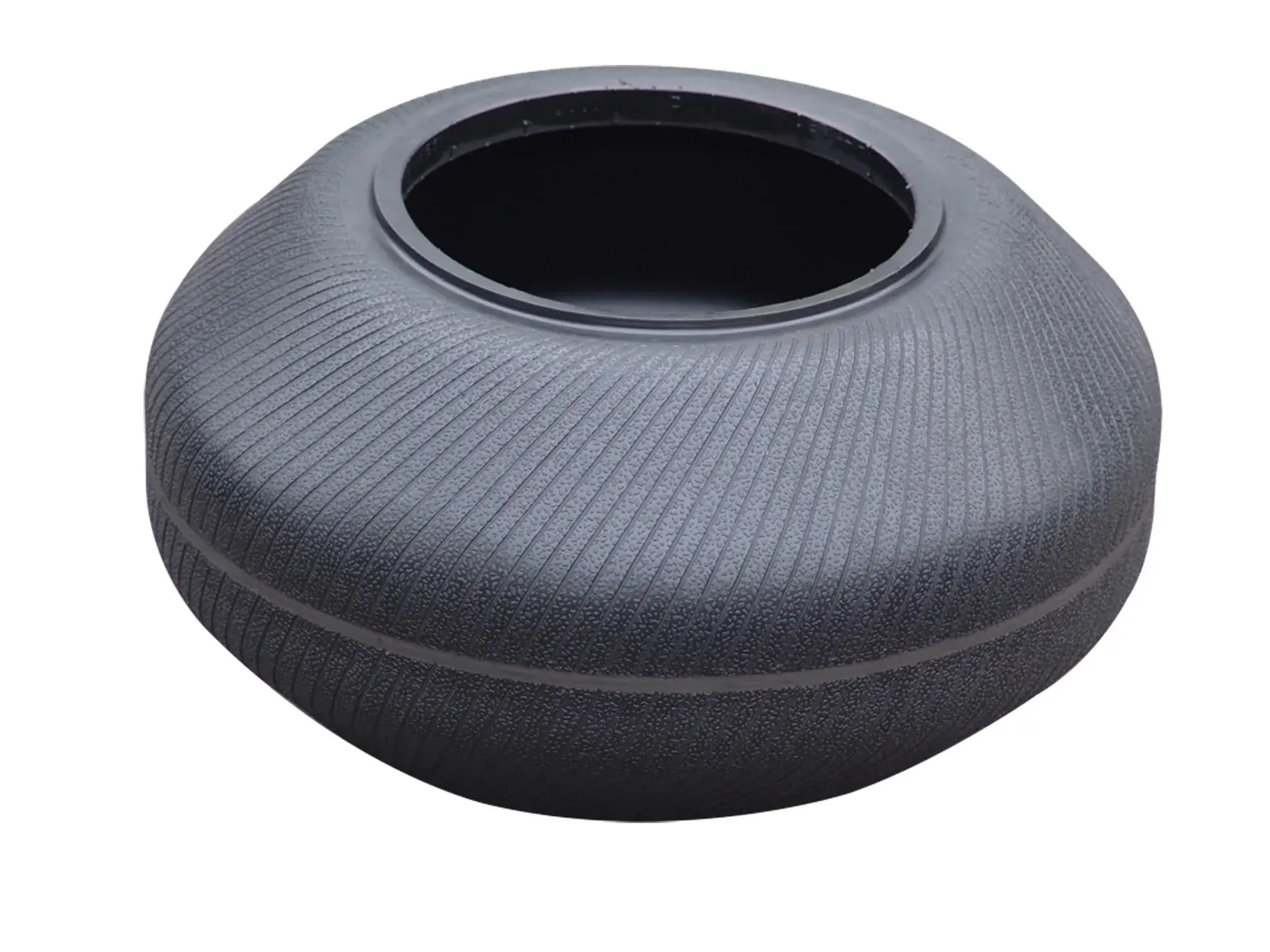 Tire curing bladder with diagonal etched grooves on a neutral background